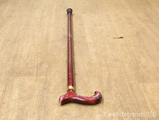 Elegant wooden cane with polished finish, T-handle grip, and decorative gold band.