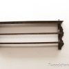 Elegant wooden wall shelf with ornate brackets for stylish storage and display.