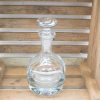 Elegant vintage glass decanter for whiskey, showcasing refinement and rustic charm in your bar.