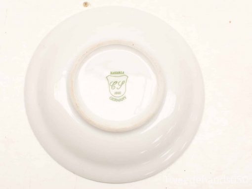 Elegant vintage porcelain plate from Bavaria, Germany, featuring a green C.P. emblem, dated 1881.