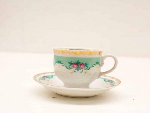 Elegant mint green tea cup and saucer set with pink roses and gold accents.