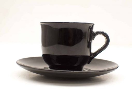 Stylish black ceramic coffee cup and saucer set for modern dining experiences.
