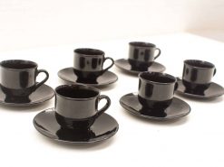 Elegant black coffee cups and saucers set, perfect for modern dining occasions.