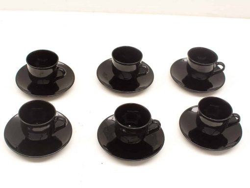 Elegant black teacup and saucer set for stylish entertaining, perfect for any occasion.