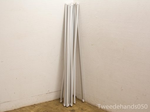 Stylish white poles for home or office: versatile and minimalist storage solutions.