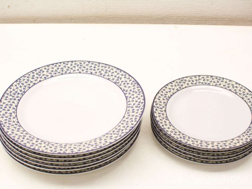 Elegant vintage ceramic plates with blue floral designs, perfect for any dining occasion.