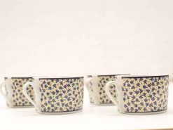 Elegant hand-painted blue floral porcelain cups, perfect for tea or coffee service.