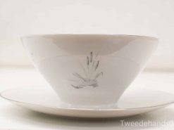 Elegant hand-painted porcelain bowl and saucer with floral designs and subtle gold detailing.