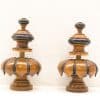 Elegant handcrafted wooden decor with tiered design and contrasting black accents, perfect for stylish interiors.
