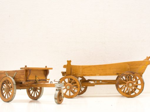 Miniature wooden carts showcasing craftsmanship and vintage charm for decor or collectibles.