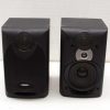 Compact Philips black bookshelf speakers for stylish audio in any space.