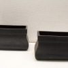 Elegant black ceramic containers set for versatile decor and stylish storage solutions.