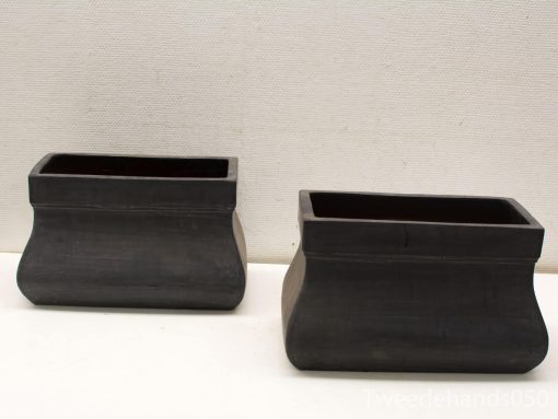 Elegant black ceramic containers set for versatile decor and stylish storage solutions.