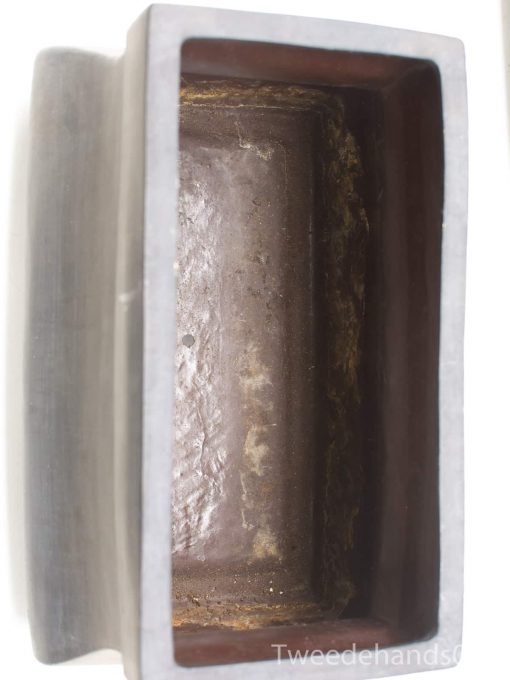 Handcrafted vintage wooden container with shiny interior, showcasing unique character and craftsmanship.