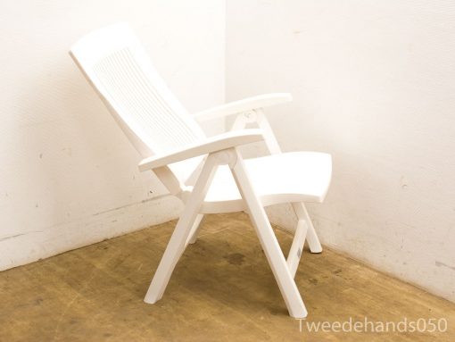 Modern white reclining chair for relaxation and comfort in indoor or outdoor spaces.