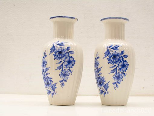 Elegant blue and white porcelain vases with intricate floral designs, perfect for any decor.