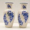 Elegant decorative vases with blue floral patterns, perfect for enhancing any interior space.