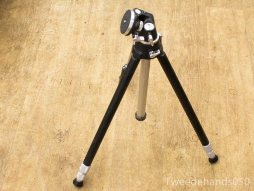 Adjustable tripod with sturdy black and metallic legs, ideal for photography and videography.