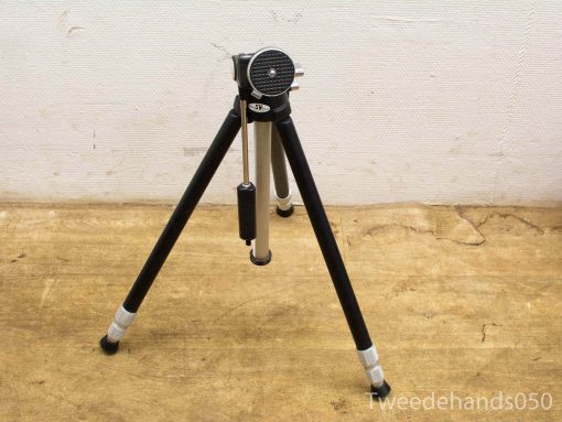 Stylish vintage aluminum camera tripod with adjustable legs and quick-release mechanism for stability.