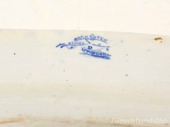 Antique blue transfer-printed pottery dish with makers mark and charming imperfections.