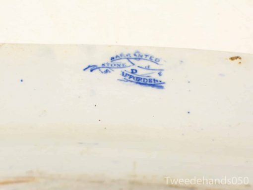 Antique blue transfer-printed pottery dish with makers mark and charming imperfections.