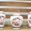 Elegant vintage vases with floral patterns, adding charm to any decor or art collection.