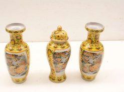 Elegant yellow porcelain vases with floral designs, perfect for enhancing home decor.