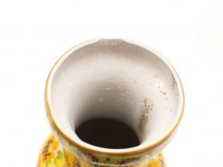Handcrafted vibrant yellow floral ceramic vase, perfect for decor with vintage charm.