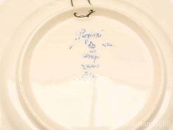 Elegant Regina Delft-style ceramic plate with wall hook and decorative blue ink stamp.
