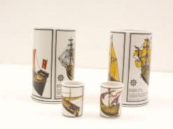 Intricate ceramic vessels featuring historical ships, perfect for collectors of maritime art.