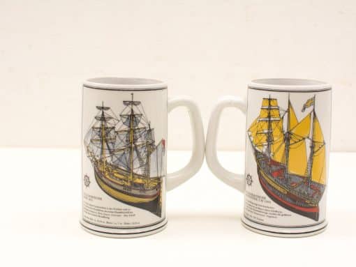Vintage maritime beer mugs featuring detailed sailing ship designs, perfect for collectors.