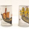Ceramic beer steins featuring historic ship illustrations, perfect for collectors and maritime enthusiasts.