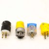 Set of four vintage electrical connectors in various styles for diverse applications.