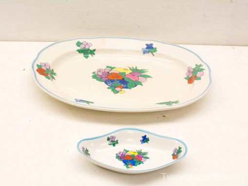 Vibrant vintage ceramic platter and dish set with floral design for elegant dining experiences.