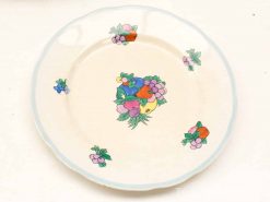 Elegant vintage ceramic plate with vibrant floral design and scalloped edge, perfect for decor.