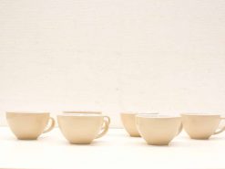 Elegant beige cups for cozy coffee moments, combining modern style with inviting comfort.