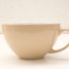 Simple ceramic cup in soft beige, perfect for enjoying your favorite hot beverages.