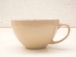 Simple ceramic cup in soft beige, perfect for enjoying your favorite hot beverages.