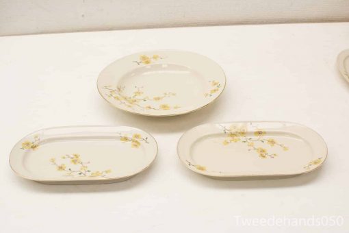 Elegant vintage porcelain serving set with floral design for special occasions and decor.