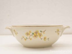 Elegant vintage serving bowl with floral design and gold accents, perfect for dining or display.