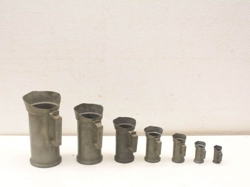 Vintage metal funnels in various sizes, ideal for kitchen and workshop use.