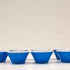 Stylish blue geometric bowls with white interiors, perfect for decor and everyday use.