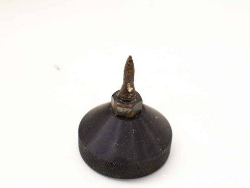 Vintage spirit level plumb bob for accurate vertical measurements in woodworking and construction.
