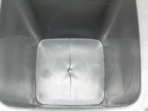 Damaged grey storage container with a glossy finish and practical rectangular design.