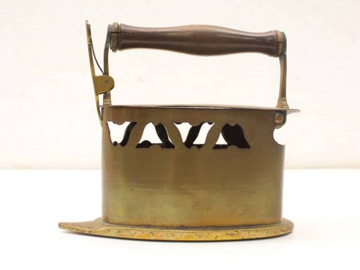 Vintage brass iron with wooden handle, showcasing elegant design and unique craftsmanship.