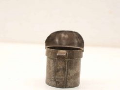 Antique metal cup with lid, perfect for storing liquids and showcasing vintage craftsmanship.