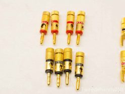 High-quality golden banana plugs for audio connections, ideal for stereo setups and easy identification.