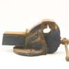 Vintage blue metal vise with wear, ideal for woodworking and metalworking projects.
