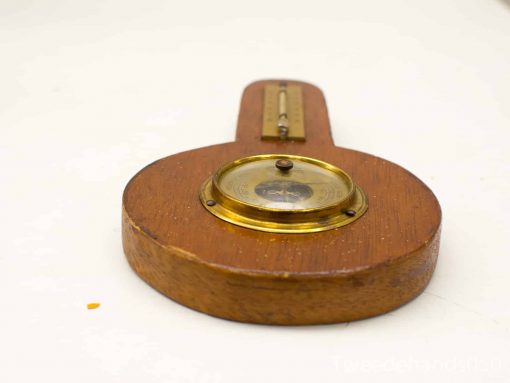 Vintage wooden barometer with brass face, exquisite craftsmanship, perfect for collectors.