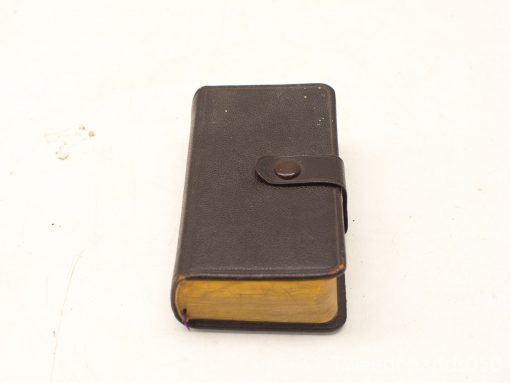 Elegant vintage leather notebook with gilded edges, ideal for journaling and treasured memories.